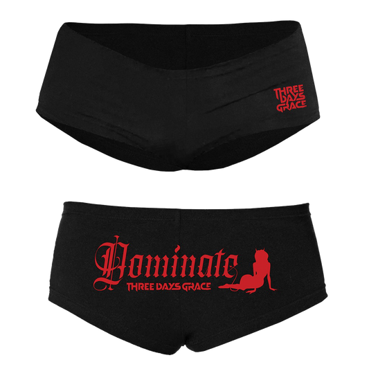 Two pairs of black women's briefs shown against a plain white background, one above the other. The top pair has a small red 'THREE DAYS GRACE' logo on the right hip, and the bottom pair has a large red 'Dominate' script with 'THREE DAYS GRACE' and a red cat silhouette on the front.